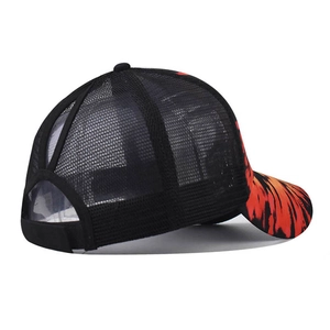 Detail of ponytail opening on black baseball cap with vibrant tie-dye flame pattern