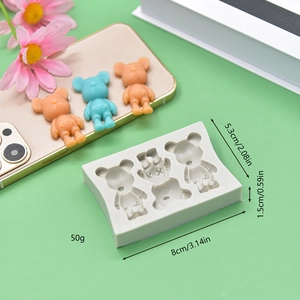 Detail of 3-cavity bear silicone mold featuring cross-eye design and texture details