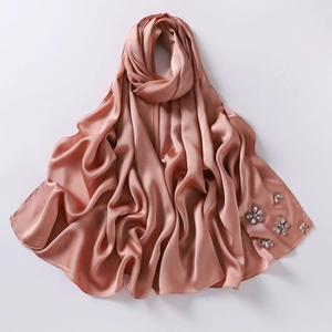 Detail of high-density chiffon hijab with handcrafted rhinestones in dusty rose finish