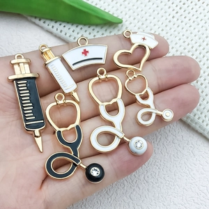 DIY medical charms including nurse hats and stethoscopes with enamel and rhinestones