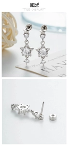 Detailed side view of silver star earrings with zircon inlay and secure screw back closure