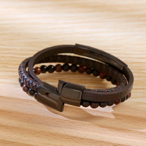 Macro view of multi-layer brown leather bracelet with natural beads and magnetic clasp