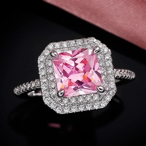 Luxurious princess cut pink zirconia ring with double halo pavé setting on black base