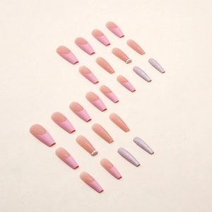 Long ballerina press-on nails with pink French tips, diamonds, and silver glitter fragments