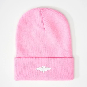 Pink ribbed knit beanie featuring a white embroidered bat pattern on folded cuff