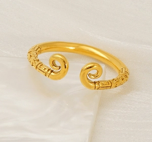 Detail of golden Monkey King open ring featuring intricate traditional engraved patterns