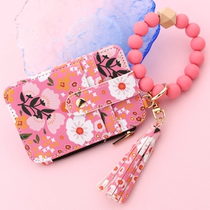 Pink floral PU leather wallet with silicone bead wristlet and tassel detail