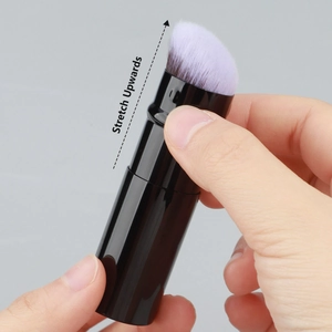 Detail of portable retractable foundation brush showing the upward stretch mechanism
