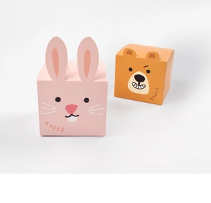 Detailed view of cute pink rabbit and orange bear shaped folding paper gift boxes