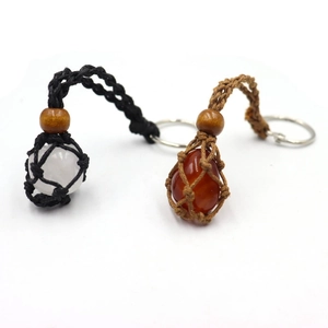 Yoga gemstone keychains with hand-woven net pouches in black and brown cord
