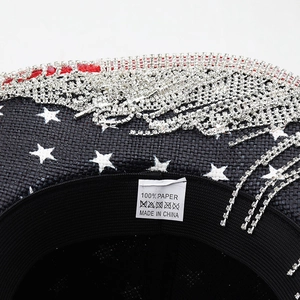 Close-up of 100% paper material label and rhinestone fringe detail on cowboy hat