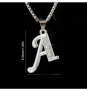 Close-up of a silver letter A pendant with sparkling rhinestones on a stainless steel chain