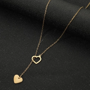 Minimalist gold stainless steel necklace with double heart pendants and elegant tassel chain