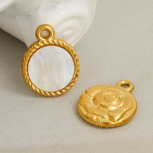 Detail of round double-sided 304 stainless steel pendant with white shell and rose relief