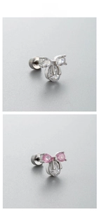 Detail of bow-shaped titanium steel studs with pink and clear zircon stones inlay