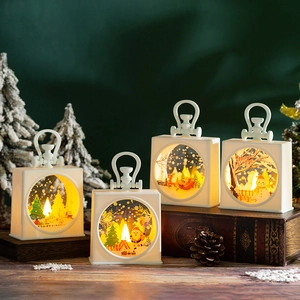 Set of four ivory white Christmas LED lanterns with warm light and festive patterns