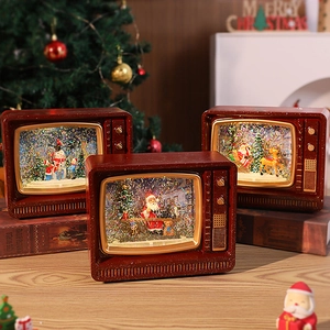 Vintage TV-shaped Christmas music box with swirling snow and festive light scenes