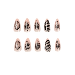 Hand-painted press on nails in almond shape with black eye patterns on nude pink base