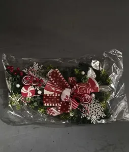 Detail view of Christmas inverted tree packaging with red stripes and snowflake decor