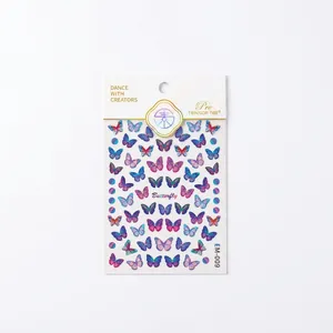 Gold foil butterfly nail art stickers EM-009 with gradient metallic finish in packaging