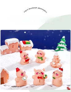 Miniature resin Christmas gingerbread man set with small tree and snowy cabin scene
