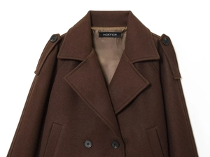 Detail of dark brown wool coat collar with notched lapels and shoulder epaulette detail