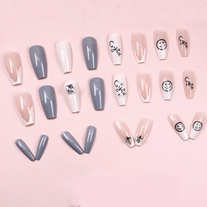 Long trapezoidal press-on nails with grey, pink, and white star smile patterns