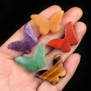 Polished natural crystal butterfly ornaments in amethyst, quartz, and tiger eye stones