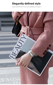 Detail of silver rectangular quartz watch with mesh strap in a stylish lifestyle setting
