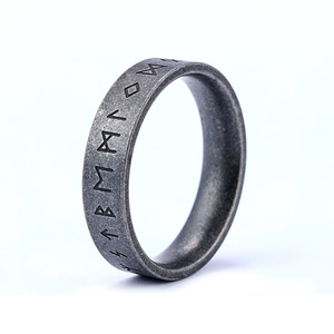 Detailed view of vintage stainless steel Viking rune ring with aged silver finish