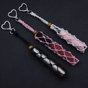 Handmade woven lipstick holders in black, pink, and white with silver heart clips