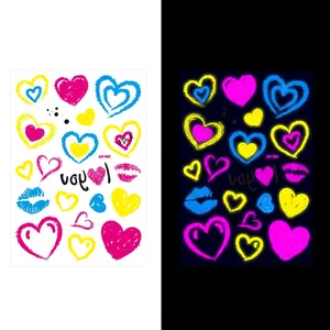 UV fluorescent heart and lip temporary tattoo stickers in vibrant pink and yellow hues