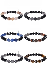 Detail view of 10mm faceted natural stone beads and stainless steel spacers on elastic bracelets