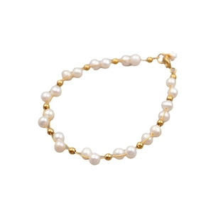 Elegant handmade freshwater pearl bracelet with gold beads and lobster clasp on white background