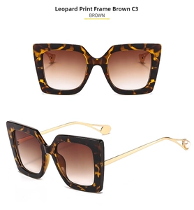 Detail of square tortoiseshell sunglasses with brown lenses and pearl metal temples