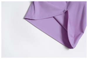 Detail shot of the V-neck yoga vest hem with professional double-needle stitching in purple