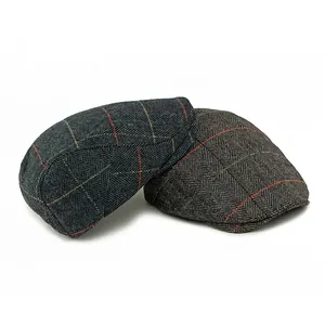 Pair of retro wool herringbone flat caps for men and women in grey and charcoal colors
