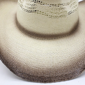 Close-up of woven straw cowboy hat showing ombre gradient texture and breathable hollow knit
