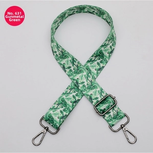 Close-up of No. 631 floral tropical pattern bag strap with gunmetal swivel hooks