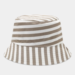 Detailed view of the striped canvas bucket hat featuring vertical and horizontal patterns