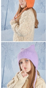 Detail of children's warm knit winter hats with cute cat ears and cozy earflaps