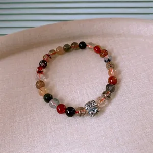 Elegant lotus rutilated quartz and red agate bracelet with silver prosperity charm
