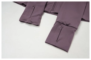 Close-up of purple yoga jacket featuring thumb hole cuffs and durable flatlock stitching