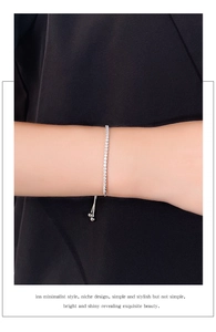 Close-up of sparkling S925 sterling silver square tennis bracelet with adjustable slider