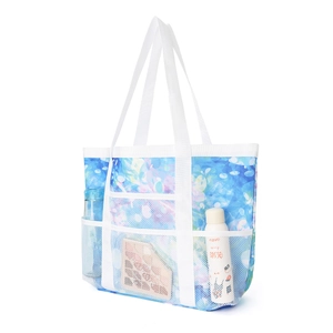 Detail der blauen Strandtasche mit großen Netz-Außentaschen für optimale Organisation