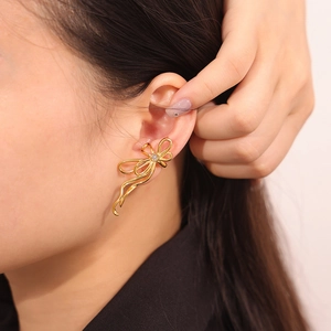 Chic gold bowknot U-shaped titanium steel earrings with white rhinestones for women