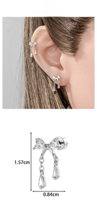Detailed size view of silver bow-knot earring with zircon stones and dangling chains
