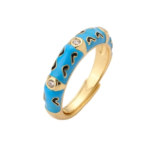 Detail of blue enamel gold ring featuring heart patterns and micro-set zircon stones
