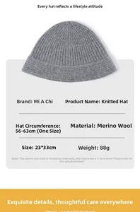 Detail of dark grey merino wool knit beanie showing ribbed texture and 23x33cm size specs