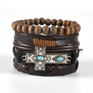 Set of four stackable men's bracelets with brown leather, wood beads and metal cross
